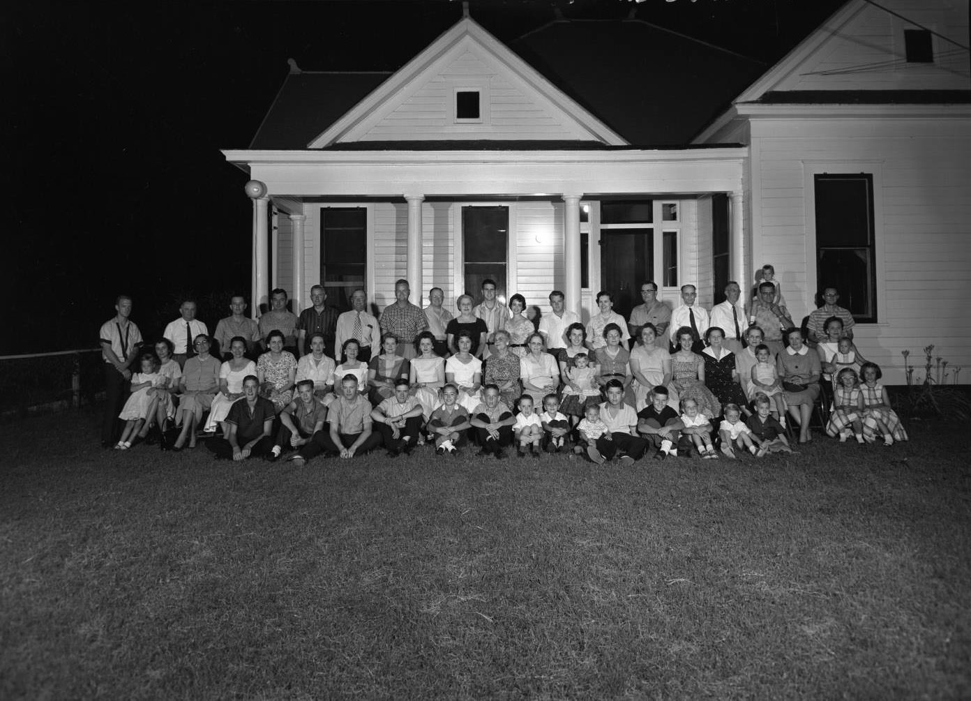 Whalen Family in Front of Victorian Cottage, 1959.