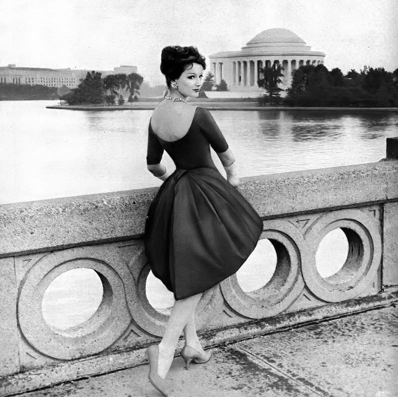 Betsy Pickering in figure-defining silk satin dress, panier framed by Jo Copeland-Patullo, 1954