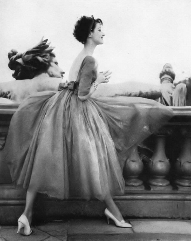 Betsy Pickering in romantic evening dress by Jacques Heim, 1957