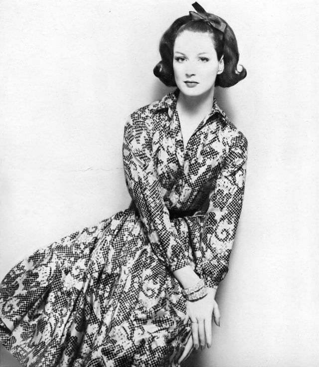 Betsy Pickering in late-day shirt dress of yellow silk surah by Anne Fogarty, 1959
