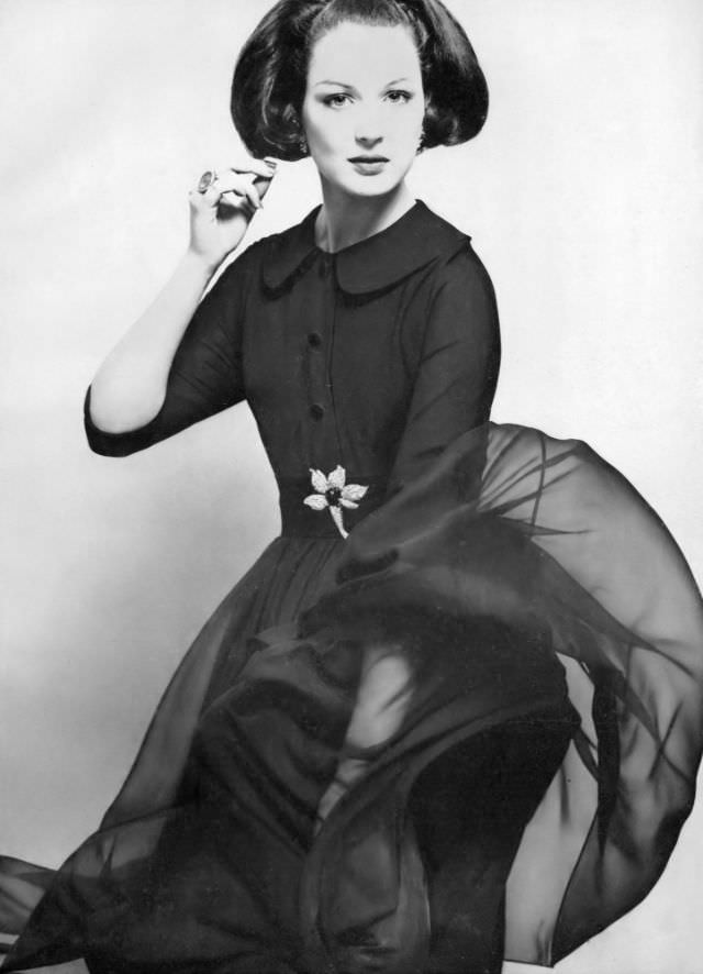Betsy Pickering in late-day shirtdress of navy blue crêpe by Larry Aldrich, 1959