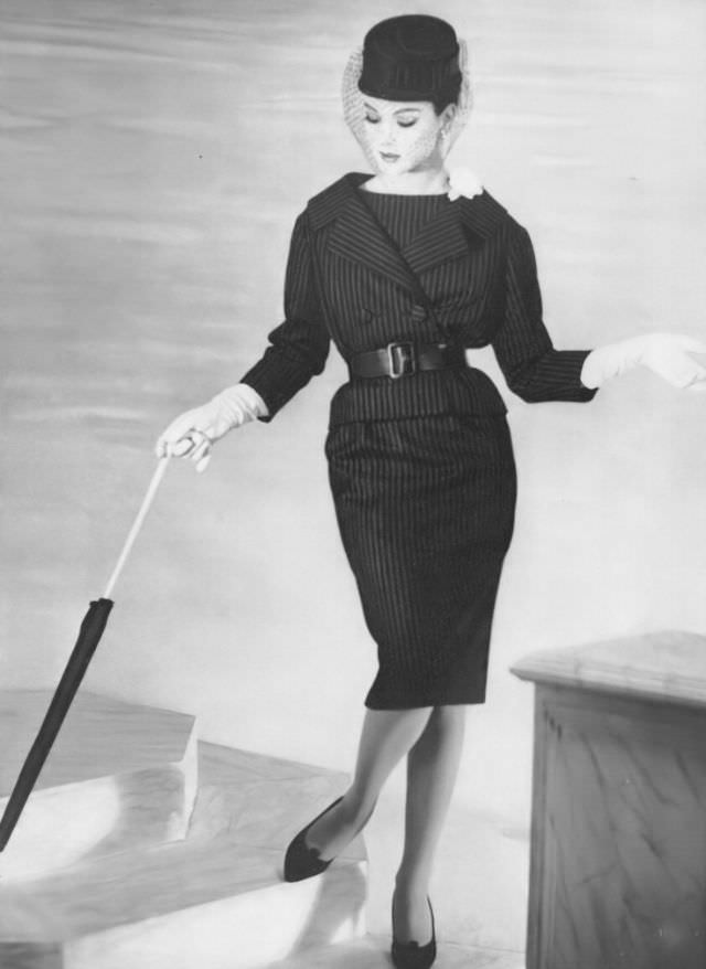 Betsy Pickering in navy blue flannel suit by YSL for Dior, 1959