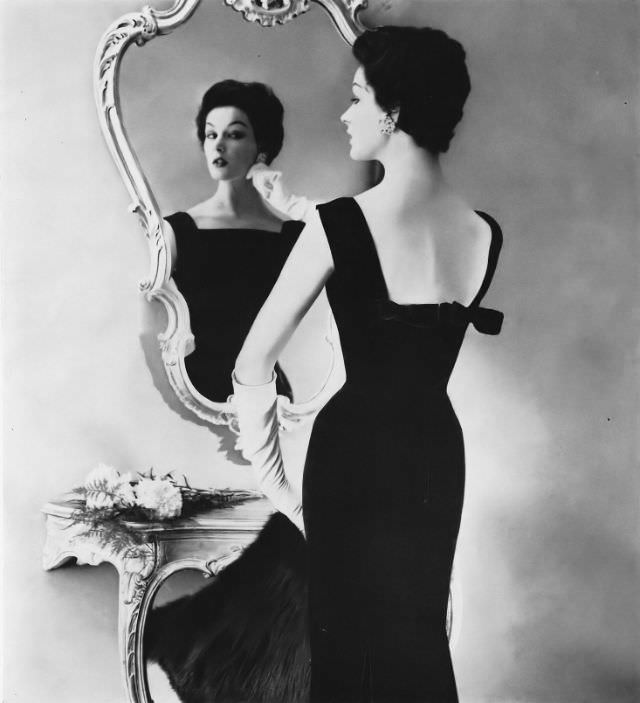 Betsy Pickering in an elegant Merrimack velveteen sheath by Anne Fogarty, 1956