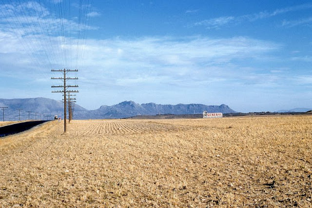 General Tires billboard in open field, probably Spain, 1961