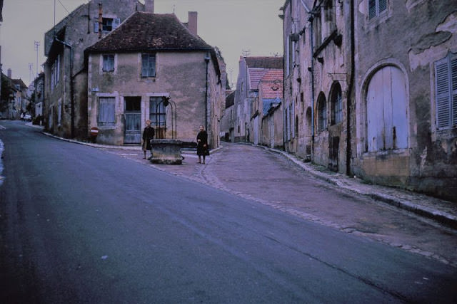 People on street, Vezelay, France, 1963