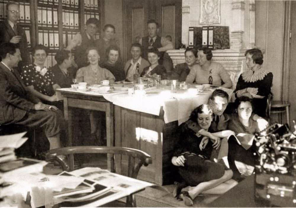 Eva Braun (on floor, at left) and colleagues at the office of Heinrich Hoffmann's photo agency, Munich, Germany, 1938.
