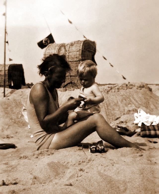 Mother and son enjoy time together at the beach in Zinnowitz, Germany during WWII