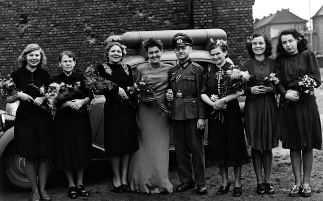 Newly wed couple with their natural gas (or coal gas) operated car, Düsseldorf, Germany during WWII