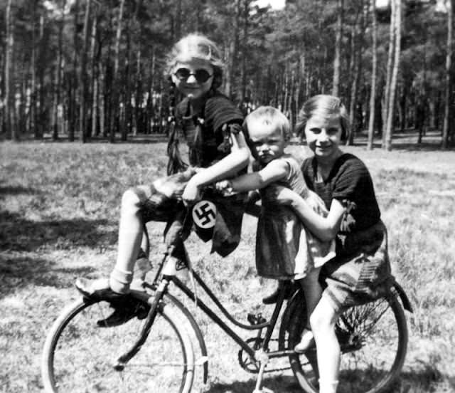 Sisters on a bike in Germany during WWII