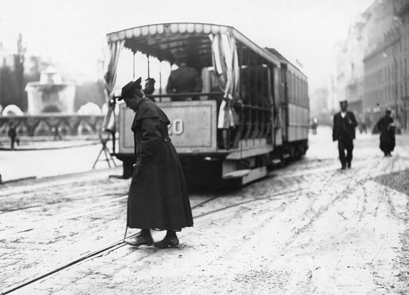 Woman changing points for the tram, Munich, Germany, around 1900.