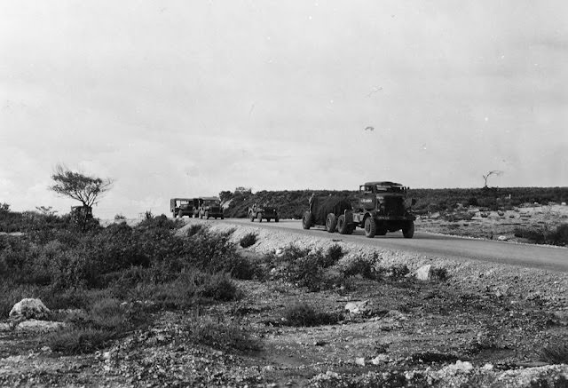 The Fat Man bomb being towed toward the airfield with an escort.