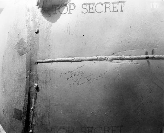 “A Second Kiss for Hirohito!” Signed by Rear Admiral W.R. Purnell, USN, on the side of Fat Man.