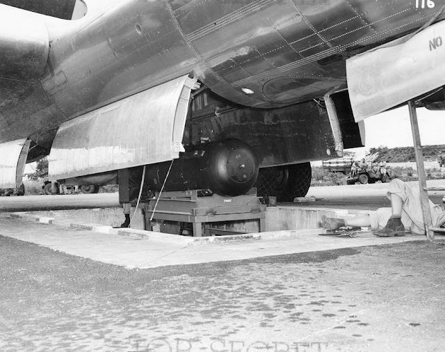 Little Boy is lifted via a hydraulic lift into the Enola Gay Little Boy is lifted via a hydraulic lift into the Enola Gay.