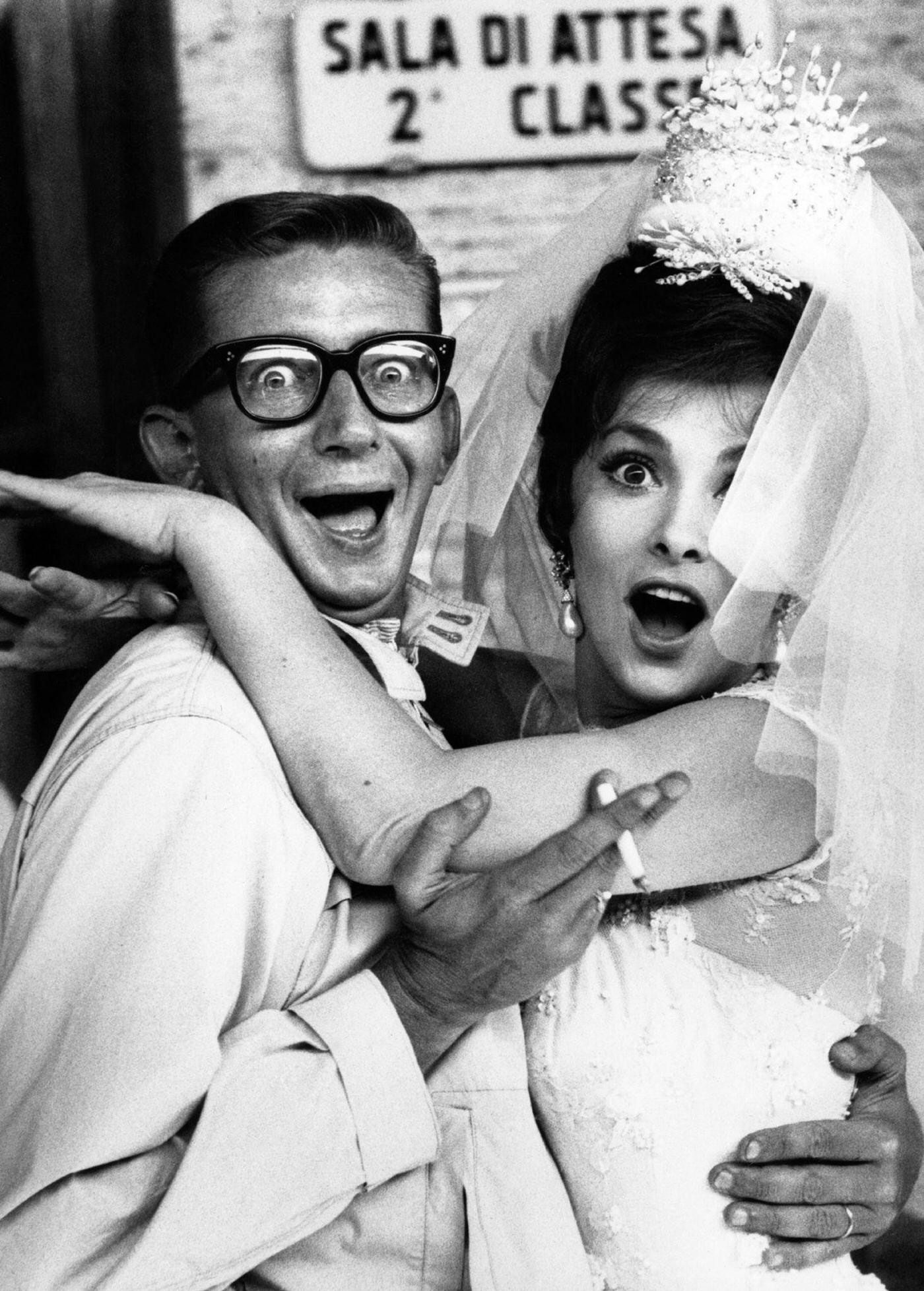 Gina Lollobrigida and Robert Mulligan goofing for a photo on the set of "Come September" in Italy, 1960.