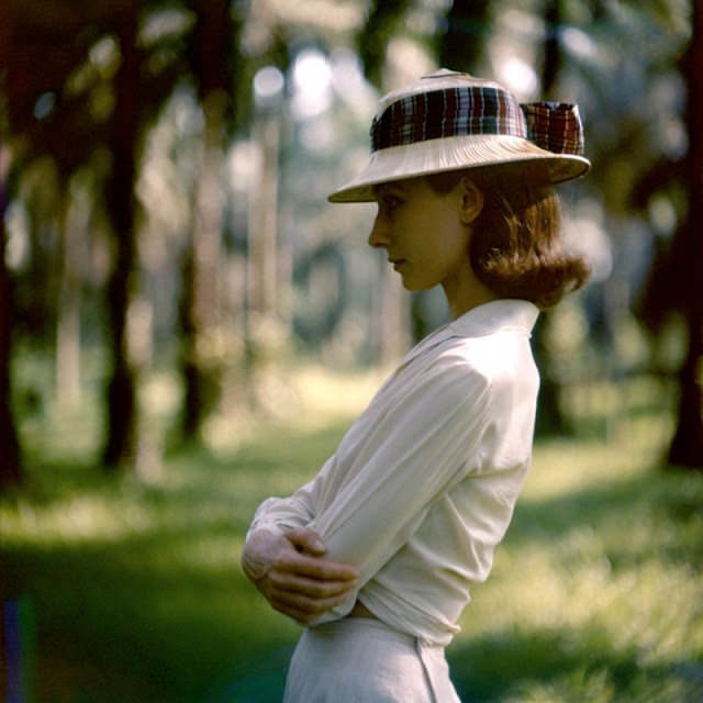 Audrey Hepburn is wearing a straw pith-helmet decorated with a wide plaid ribbon, in the Belgian Congo during filming of "The Nun's Story", 1958