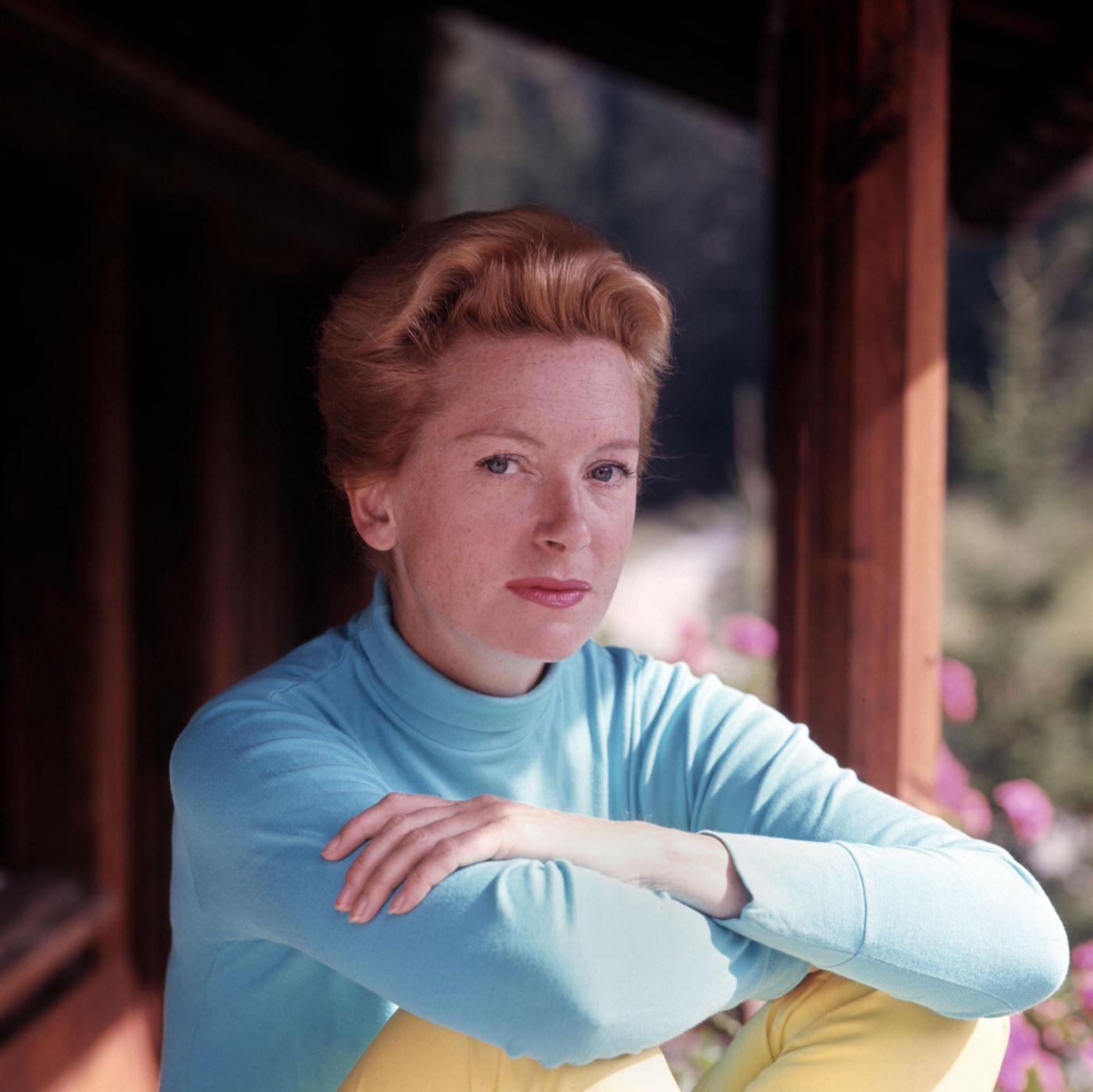 Deborah Kerr posing for a portrait in a blue top outside her residence, Los Angeles, California, 1956