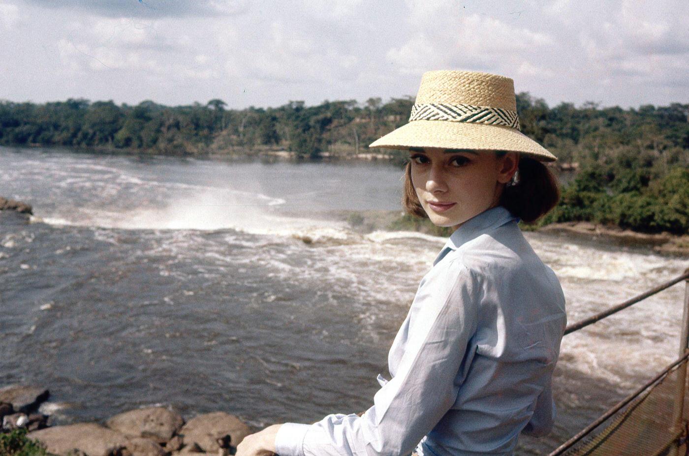Actress Audrey Hepburn crossing a river bridge in Congo, 1958.