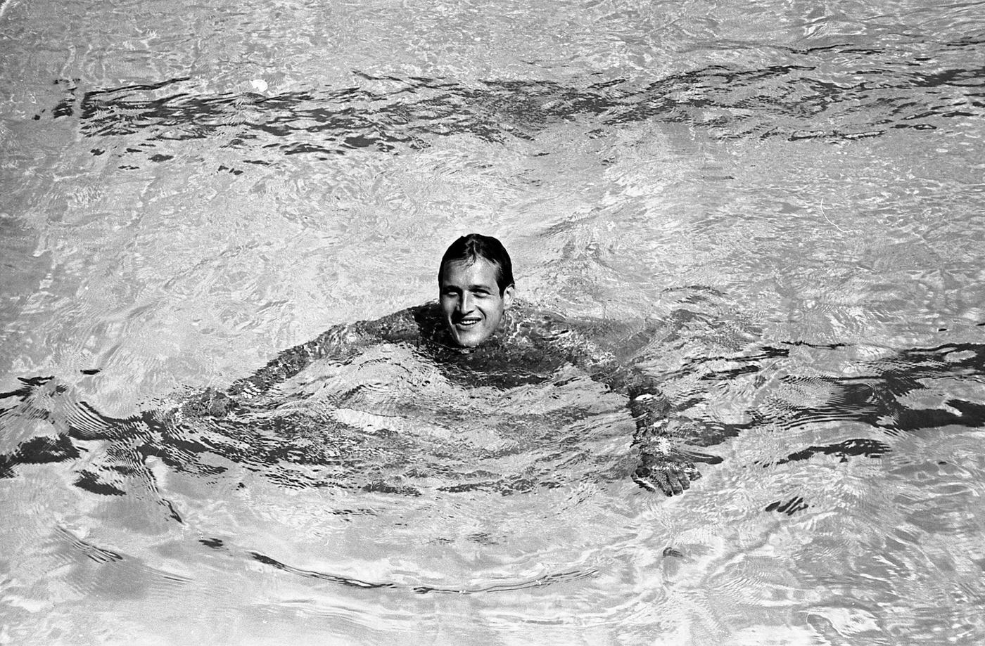 Actor Paul Newman relaxes swimming after filming "Exodus" in Israel, 1959.
