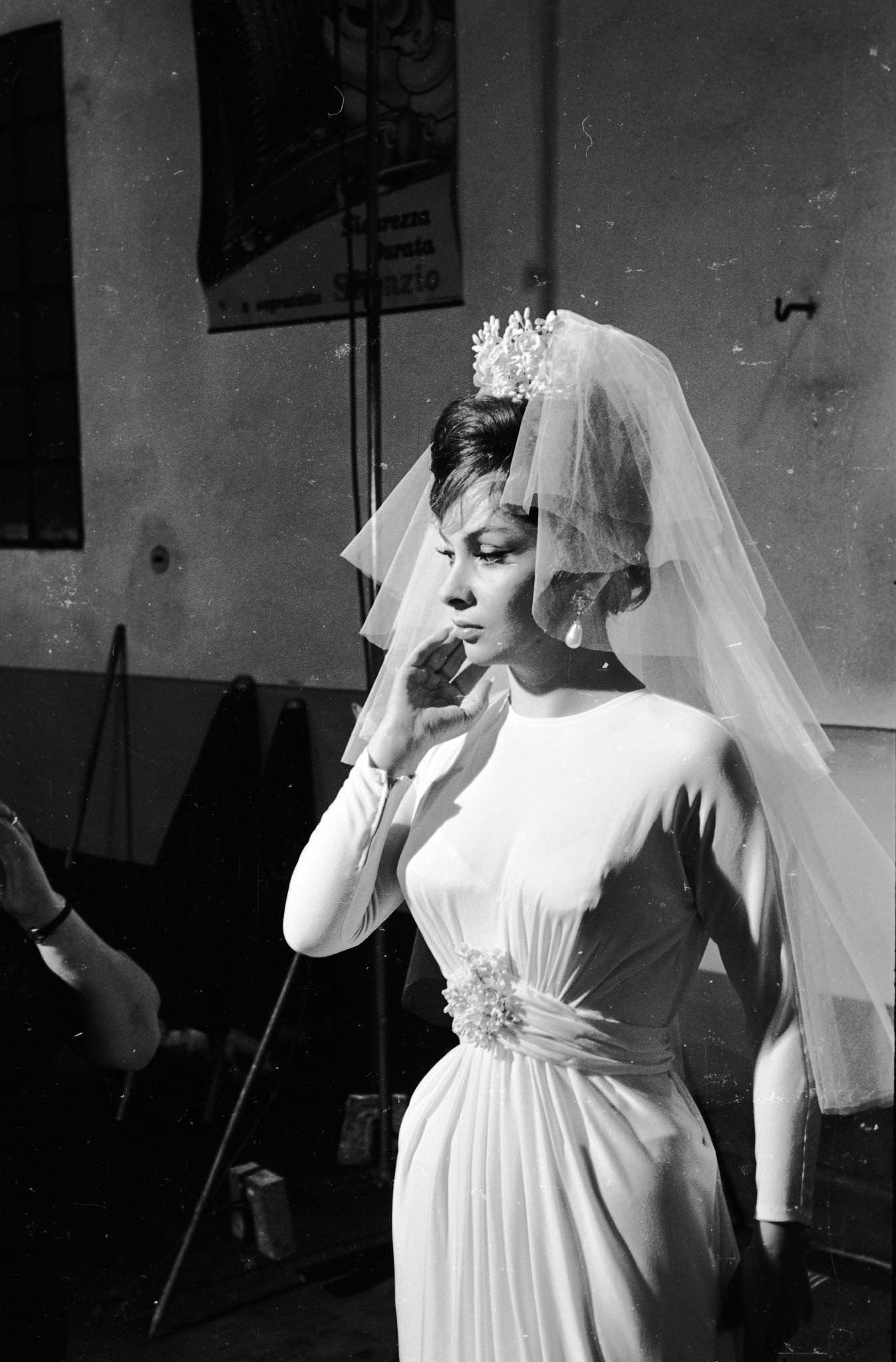 Gina Lollobrigida dressing as a bride for "Come September" in Roma, Italy, 1960.