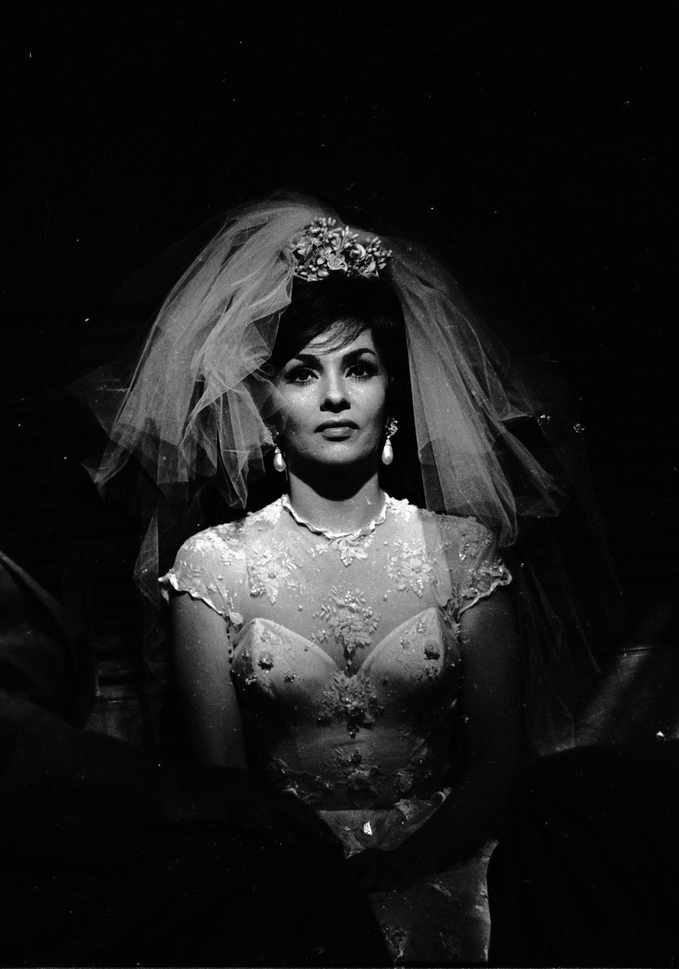 Gina Lollobrigida dressing as a bride for "Come September" in Roma, Italy, 1960.