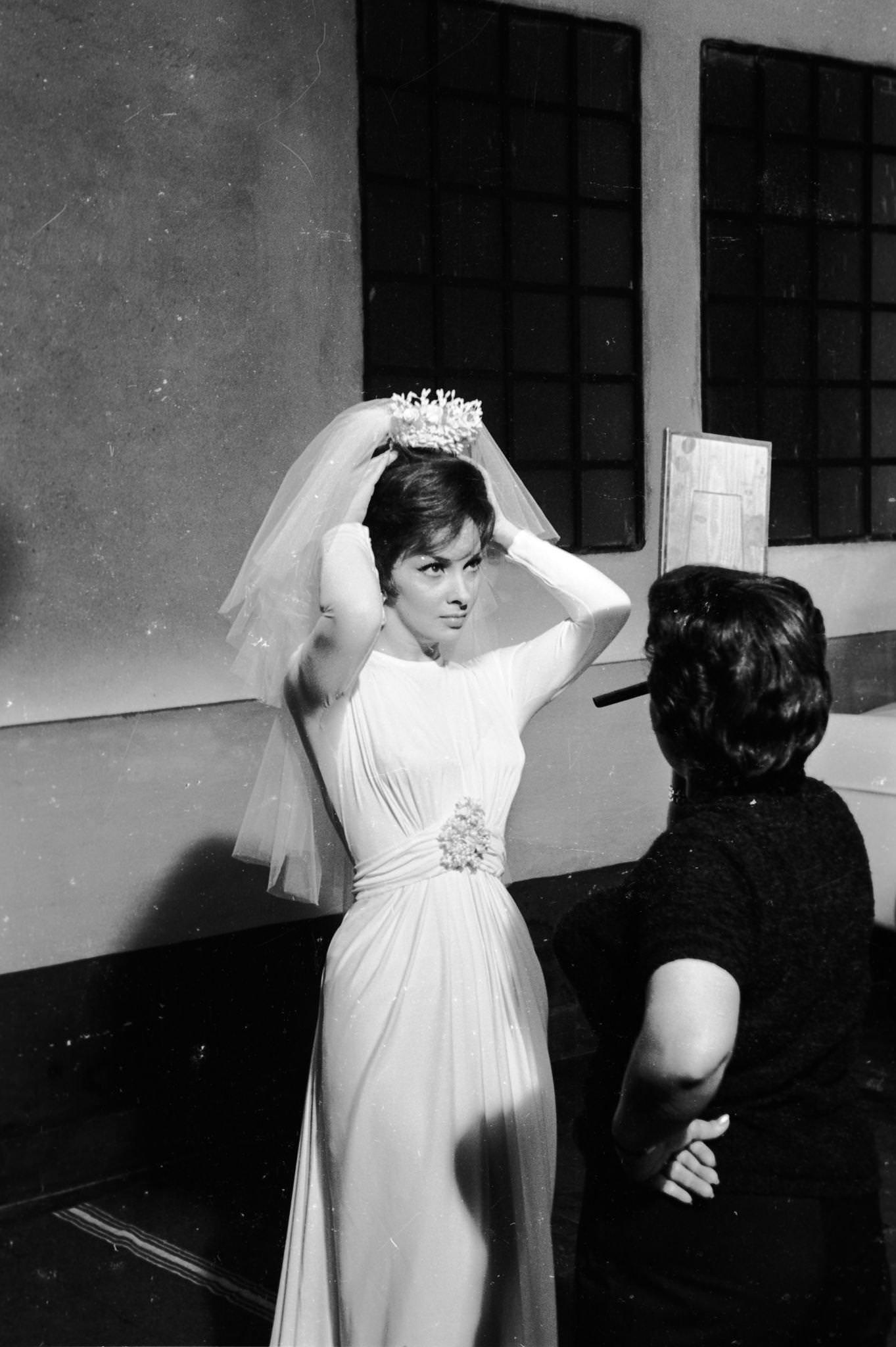 Gina Lollobrigida dressing as a bride for "Come September" in Roma, Italy, 1960.