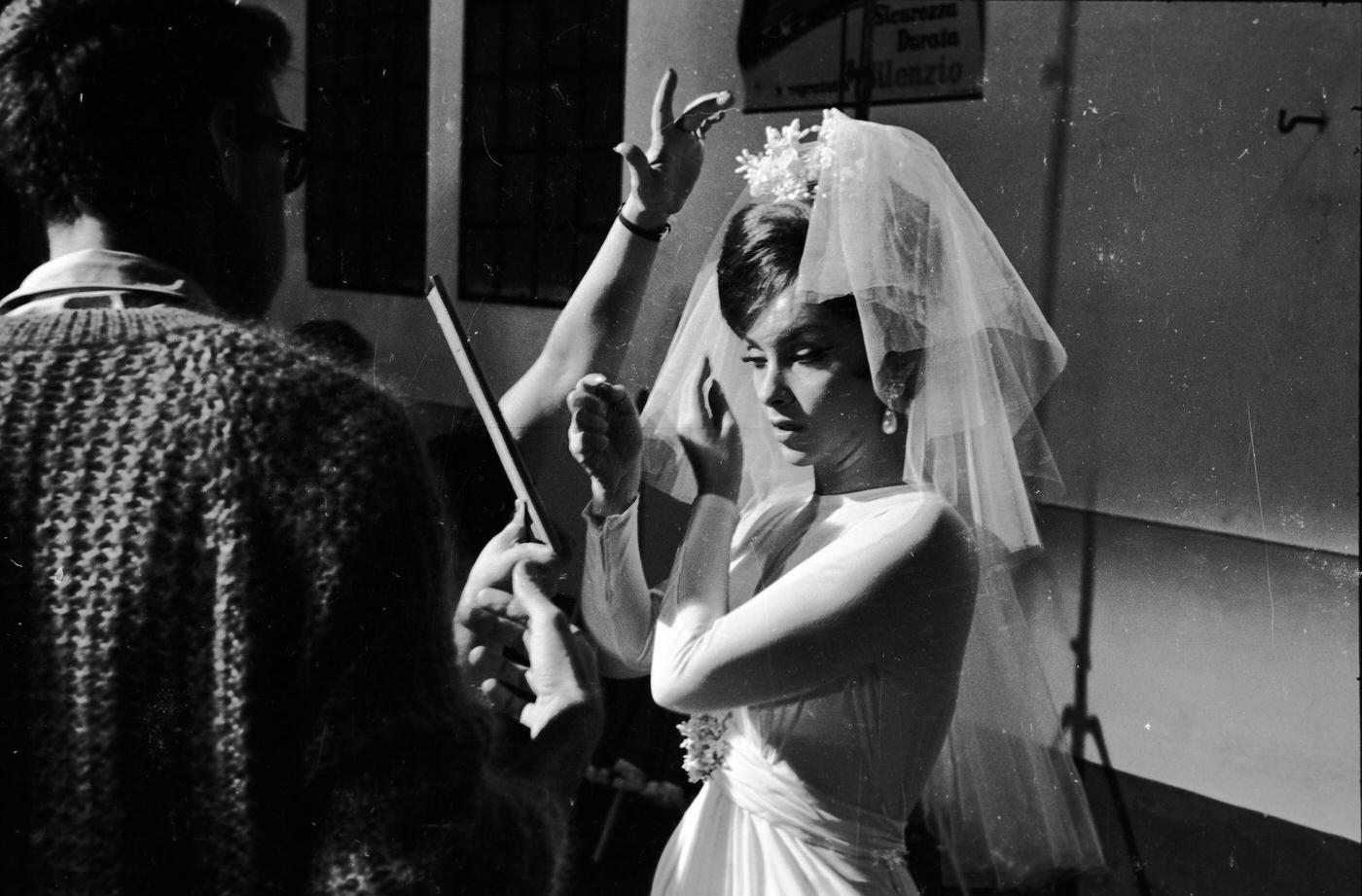 Gina Lollobrigida dressing as a bride for "Come September" in Roma, Italy, 1960.
