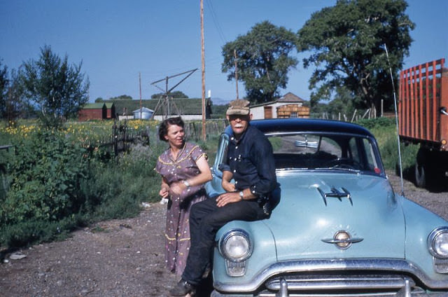 Funny Couple with Oldsmobile, Possibly Wyoming, Circa 1950s