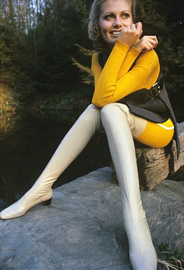 Maud Adams in Thigh-High Boots by Delman and Gray Wool Tunic Over Yellow Ribbed Sweater by Bonnie Cashin, Alexis Waldeck Photo, Vogue, August 1967
