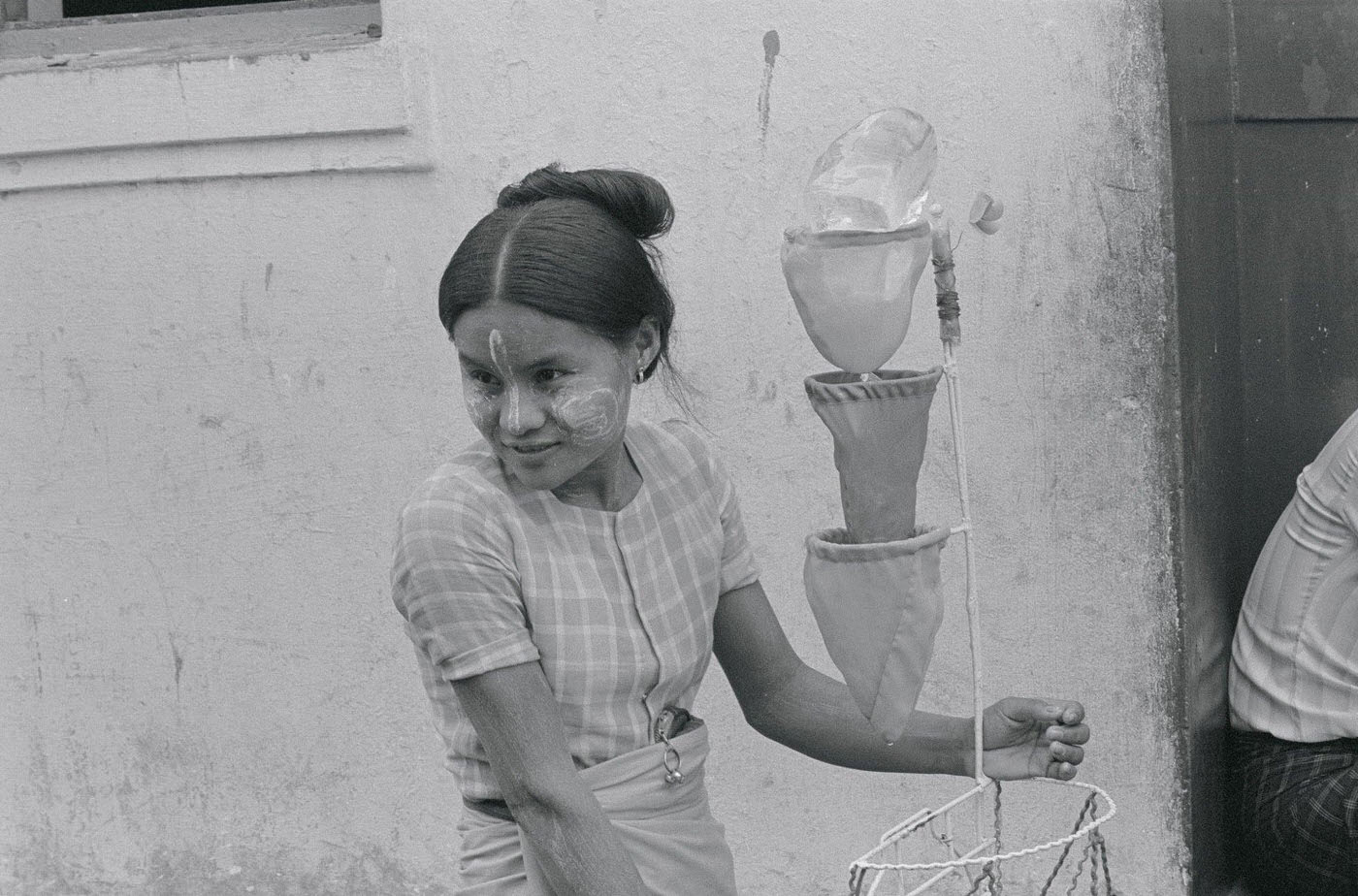 Young Woman Selling Water as a Luxury for People in the Streets of Rangoon, Burma