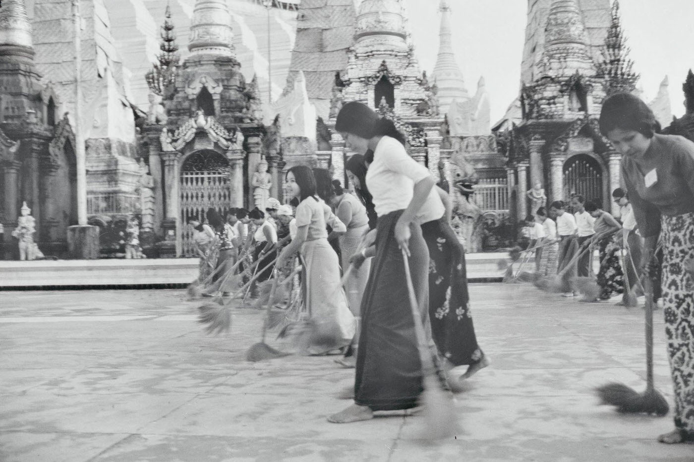 Pious Burmese Women Clean the Marble-Covered Grounds of the Schwedagon Temple in Rangoon