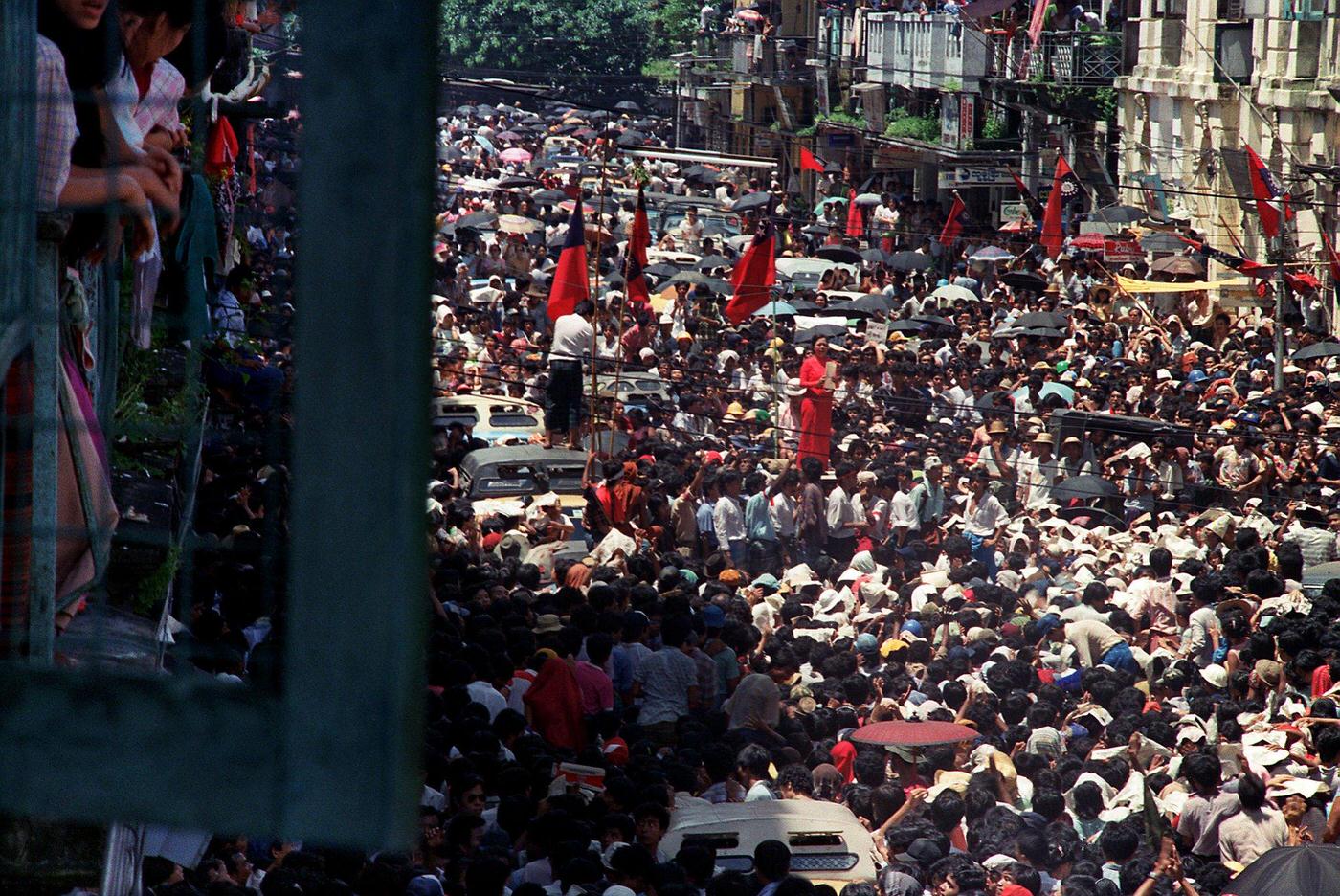 Burmese woman leading anti-government protestors in Rangoon during the 8888 Uprising, 1988.