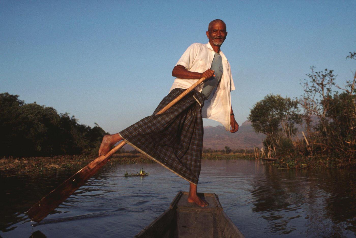 Maung Oo, a boatman leg rowing on Inle Lake in Burma, 1988.