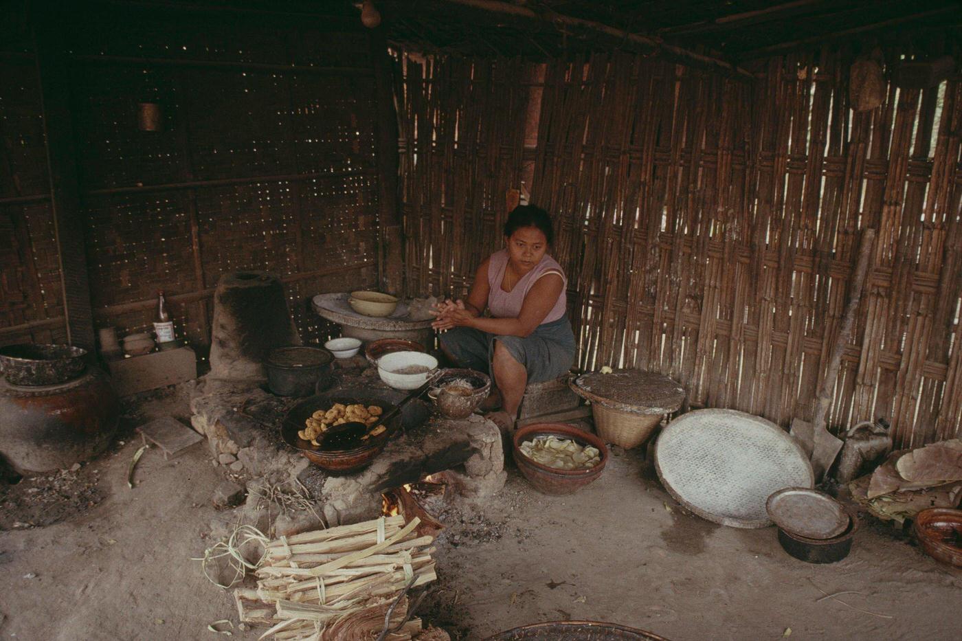 A woman cooking at home in Pagan or Bagan, Burma, 1988.