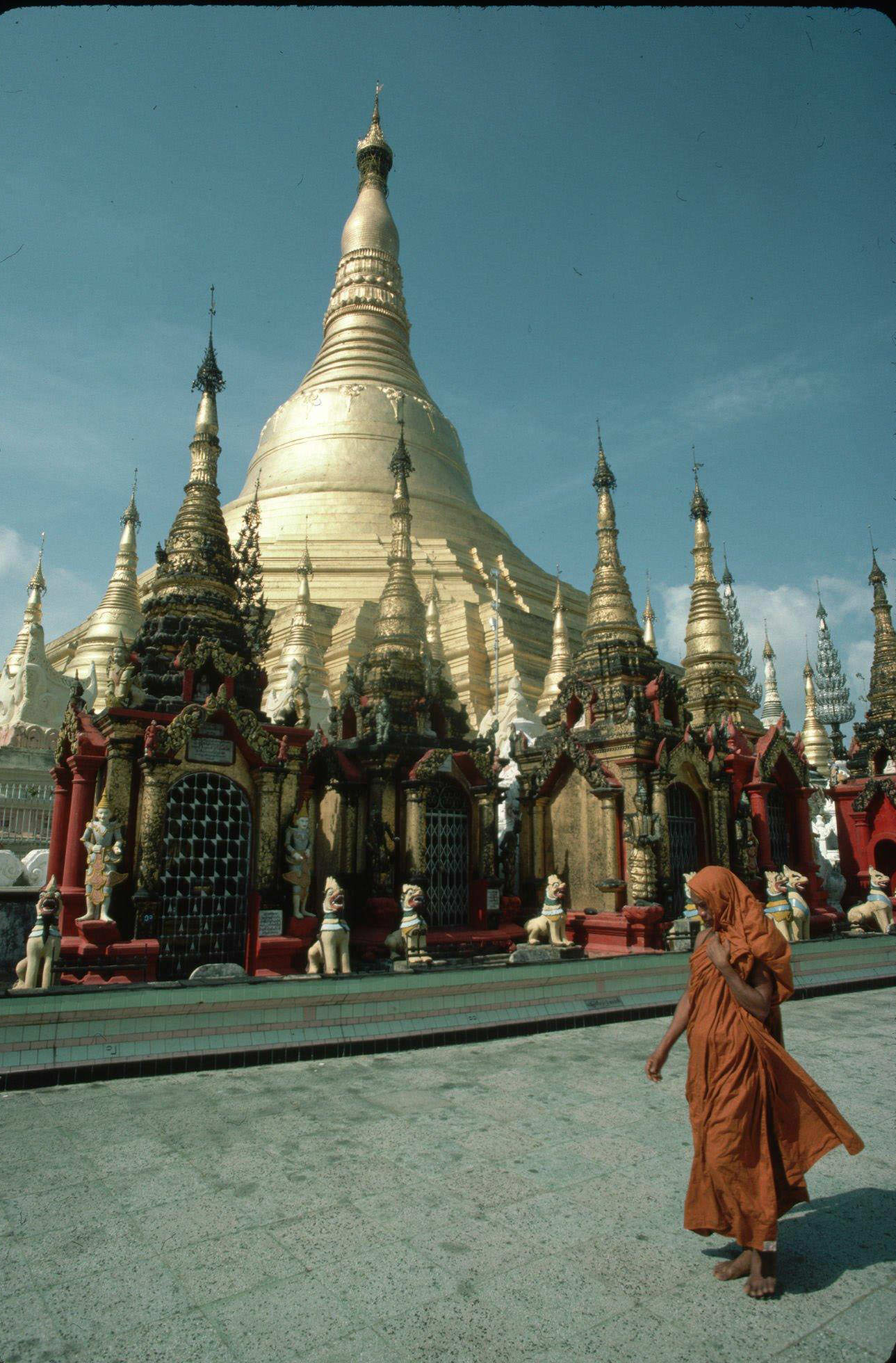 Buddhist Monk Walks by Shwe Dagon Pagoda