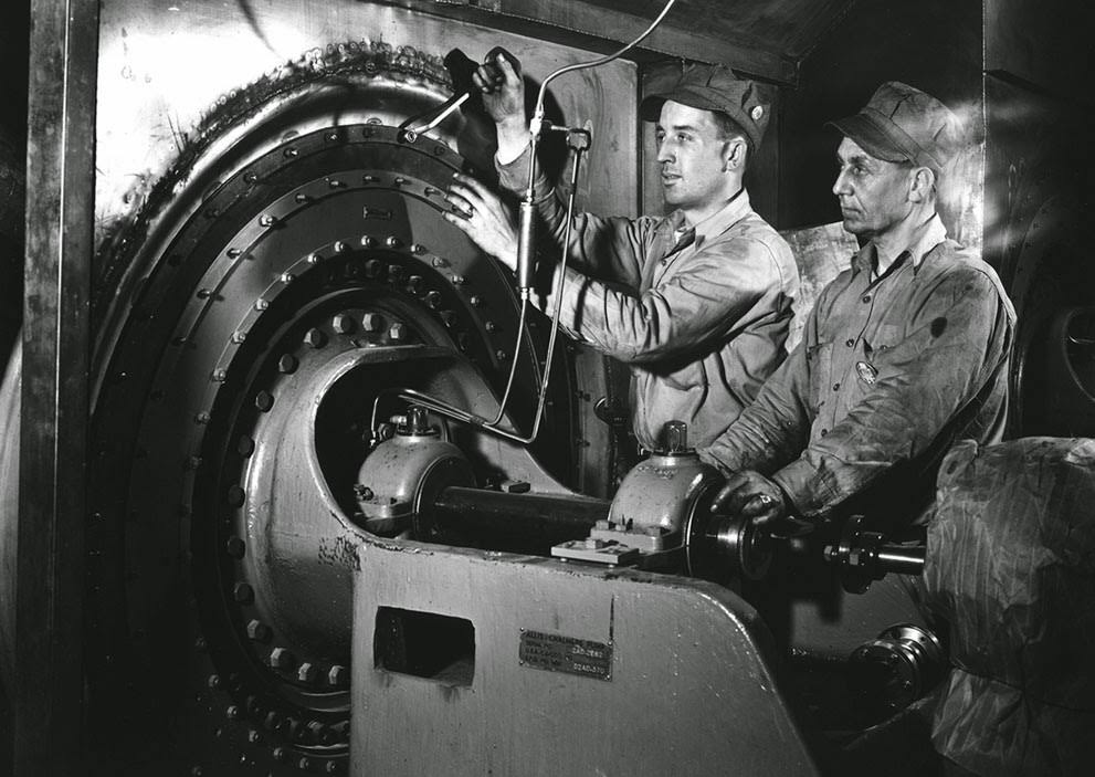 Workers perform maintenance in K-25 uranium enrichment facility, Oak Ridge, Tennesee, 1940s