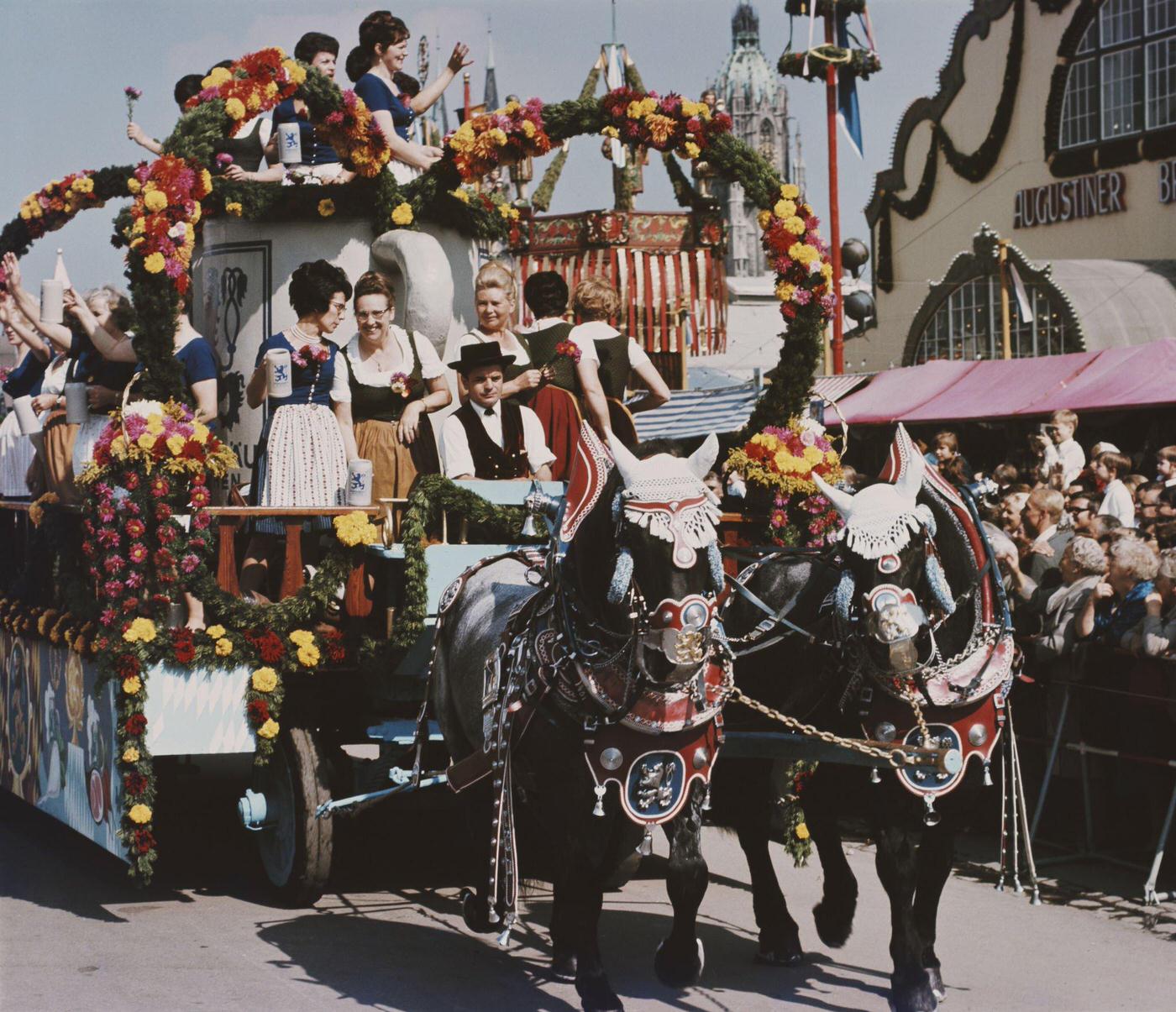 Oktoberfest parade passing Augustiner Festhalle in Munich, 1960.