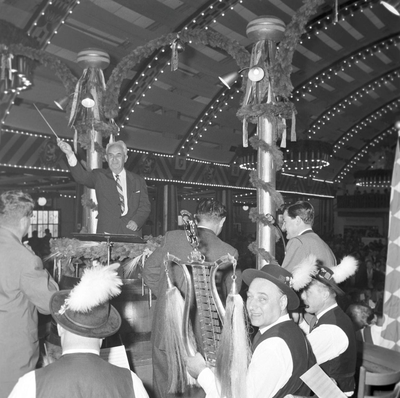 Composer Walt Erdale conducts brass band at Oktoberfest, 1963.