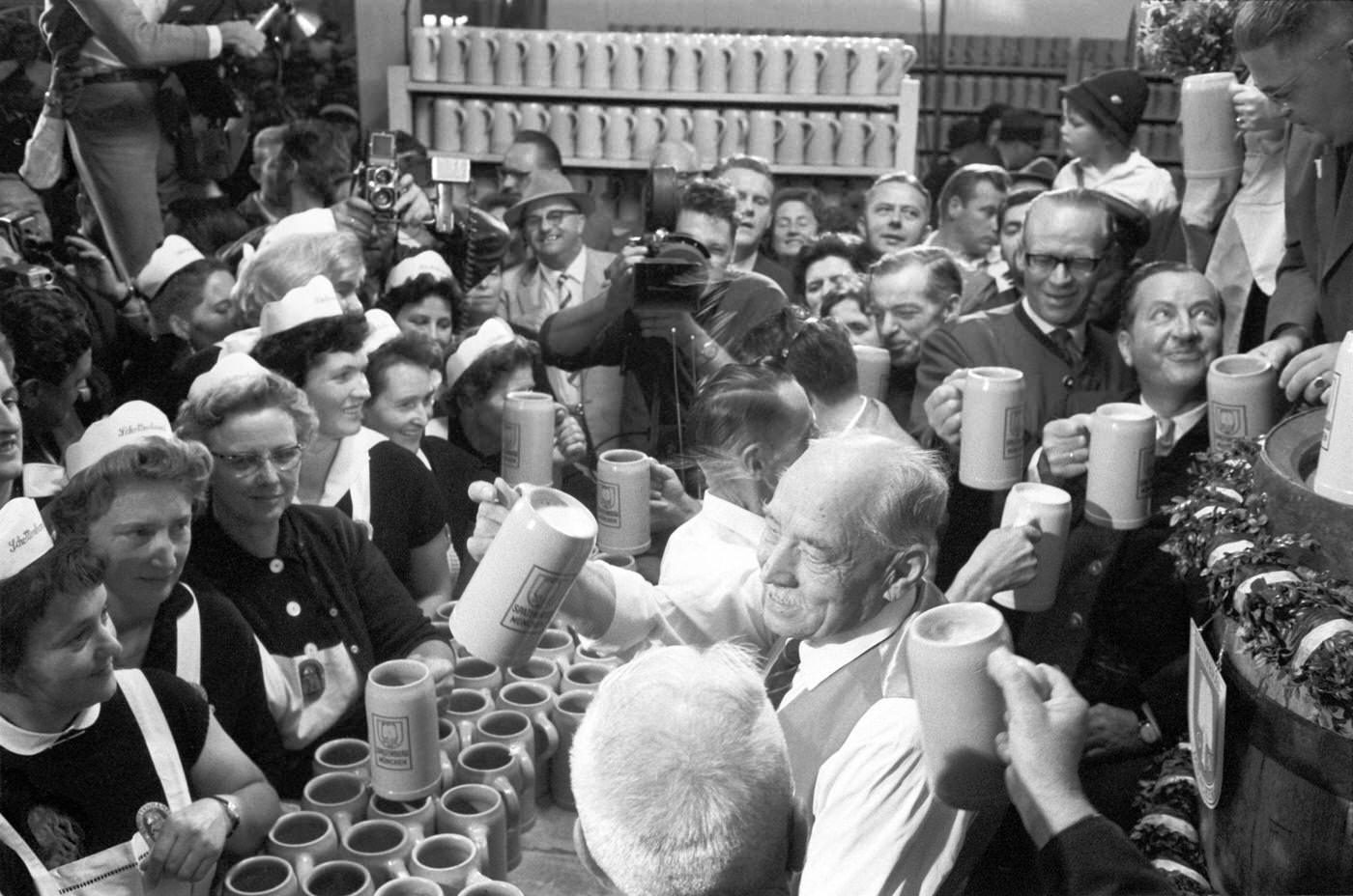 Mayor Thomas Wimmer taps first barrel at Oktoberfest, 1963.