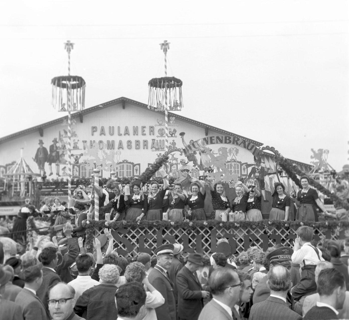 Wiesn waitresses arrive at Paulaner marquee, 1963.