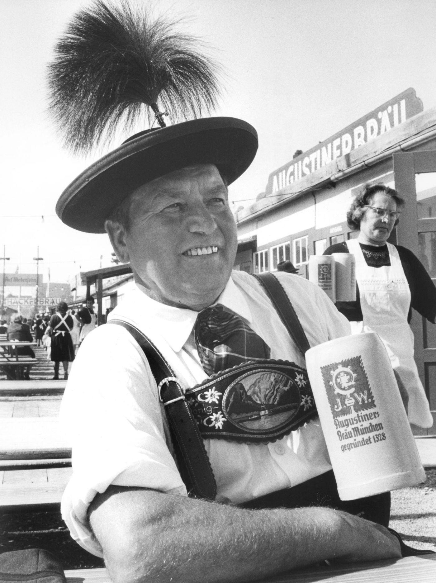 Bavarian man with beer tankard at Oktoberfest, 1964.