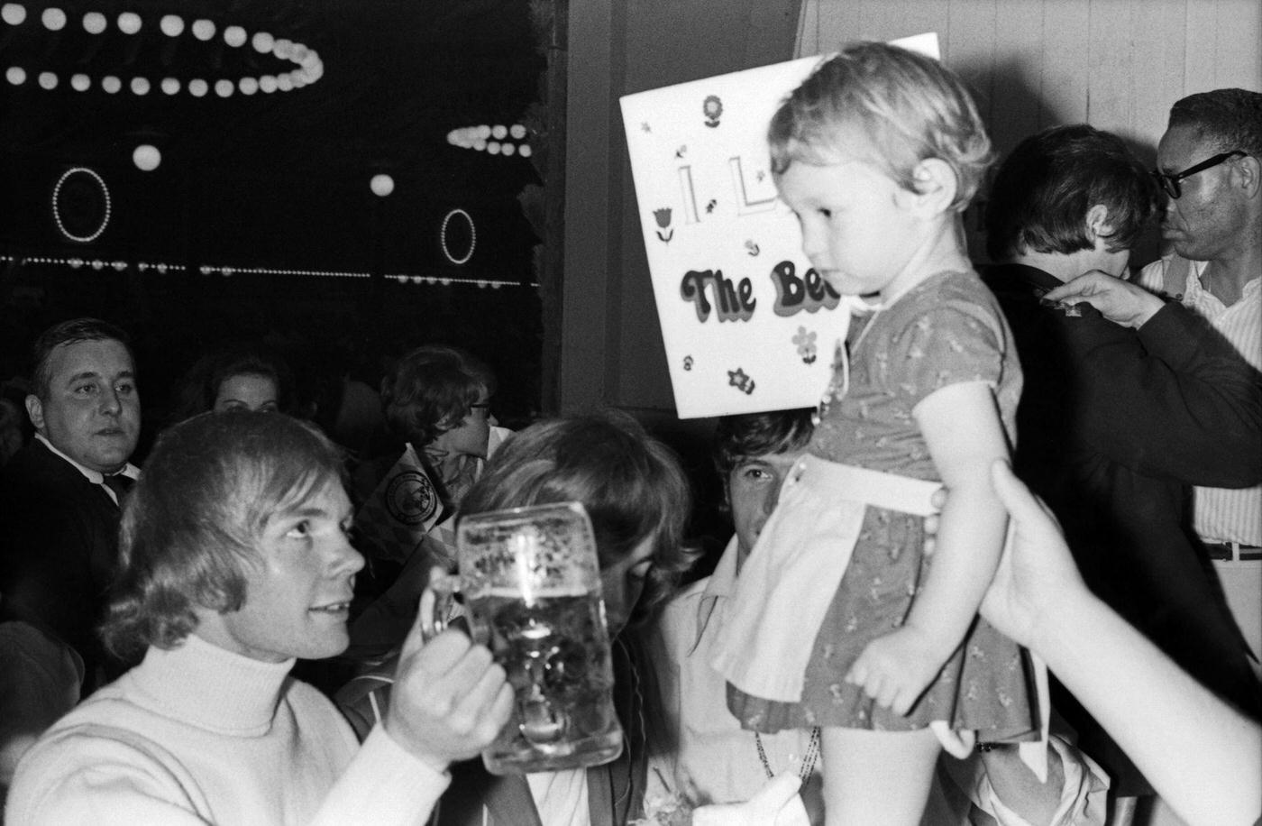 The Bee Gees with fans at Munich Oktoberfest. 1960s.