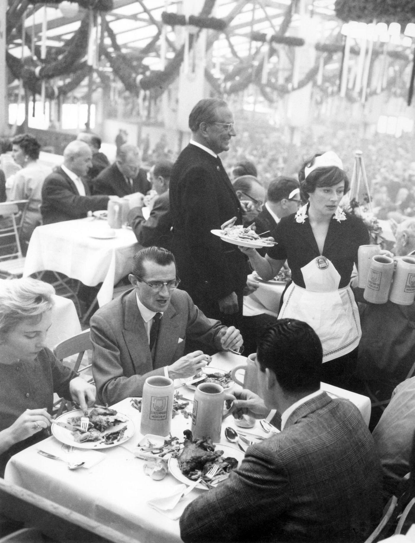 Elfie Pertramer as Wiesn waitress at Oktoberfest Munich, 1960.