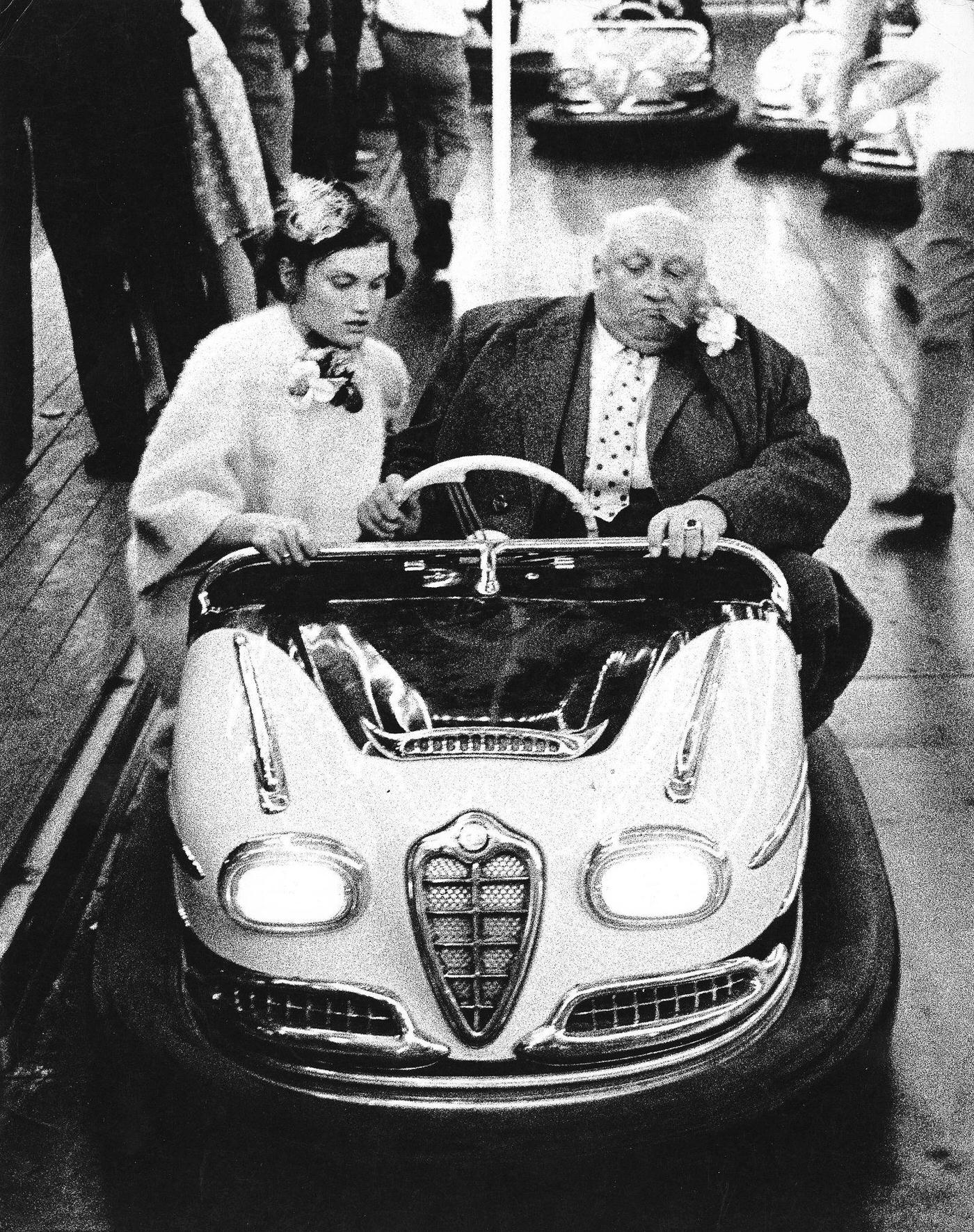 Fat man and woman in a Dodgem at Oktoberfest, 1968.