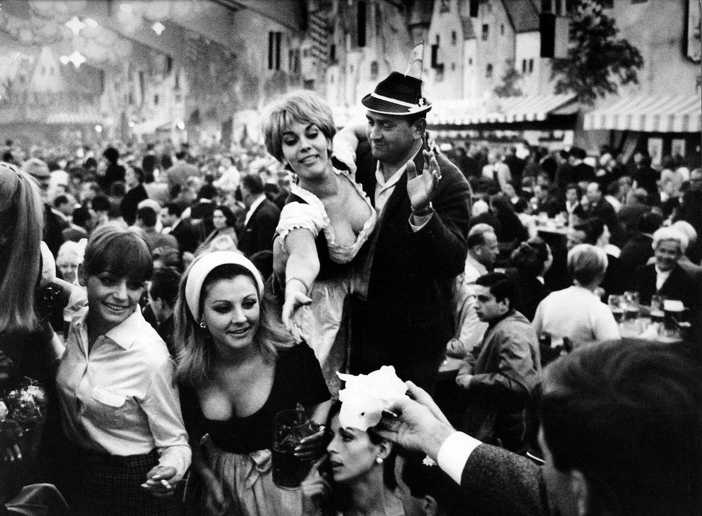 Frolic people drinking beer in a beer tent, 1969.