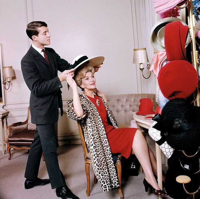 Young Halston Places a Hat on Actress Anita Colby's Head at Bergdorf Goodman, 1965