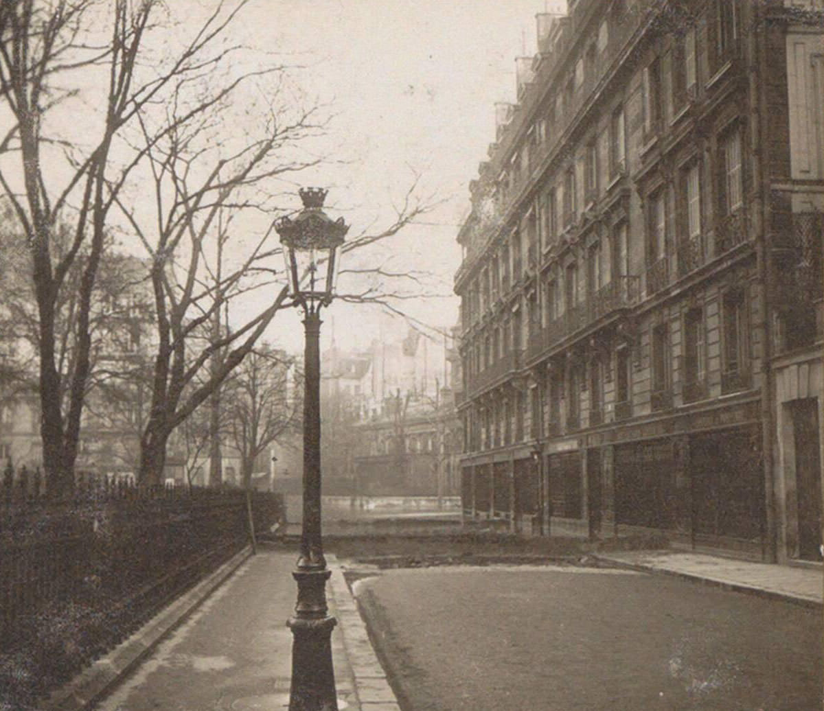 Dry road with a dam during Paris flood. Part of photo album of the 1910 flooding in Paris and suburbs.