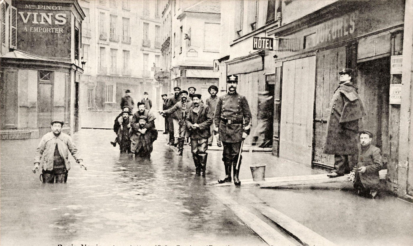 Vintage French postcard: sewer workers and gendarmes during flooding at rue des Grands-Degres, Paris, circa January 1910.