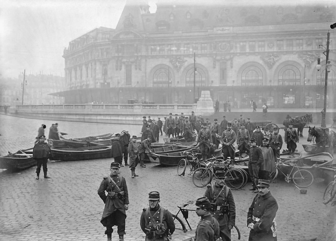 Historic flooding of Paris, 1910 - Army engineers with boats in front of Gare de Lyon.