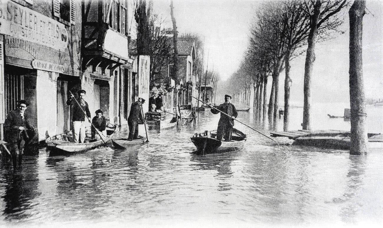 Old postcard of Paris floods, January 1910 - Asnières, post bordering boat houses.