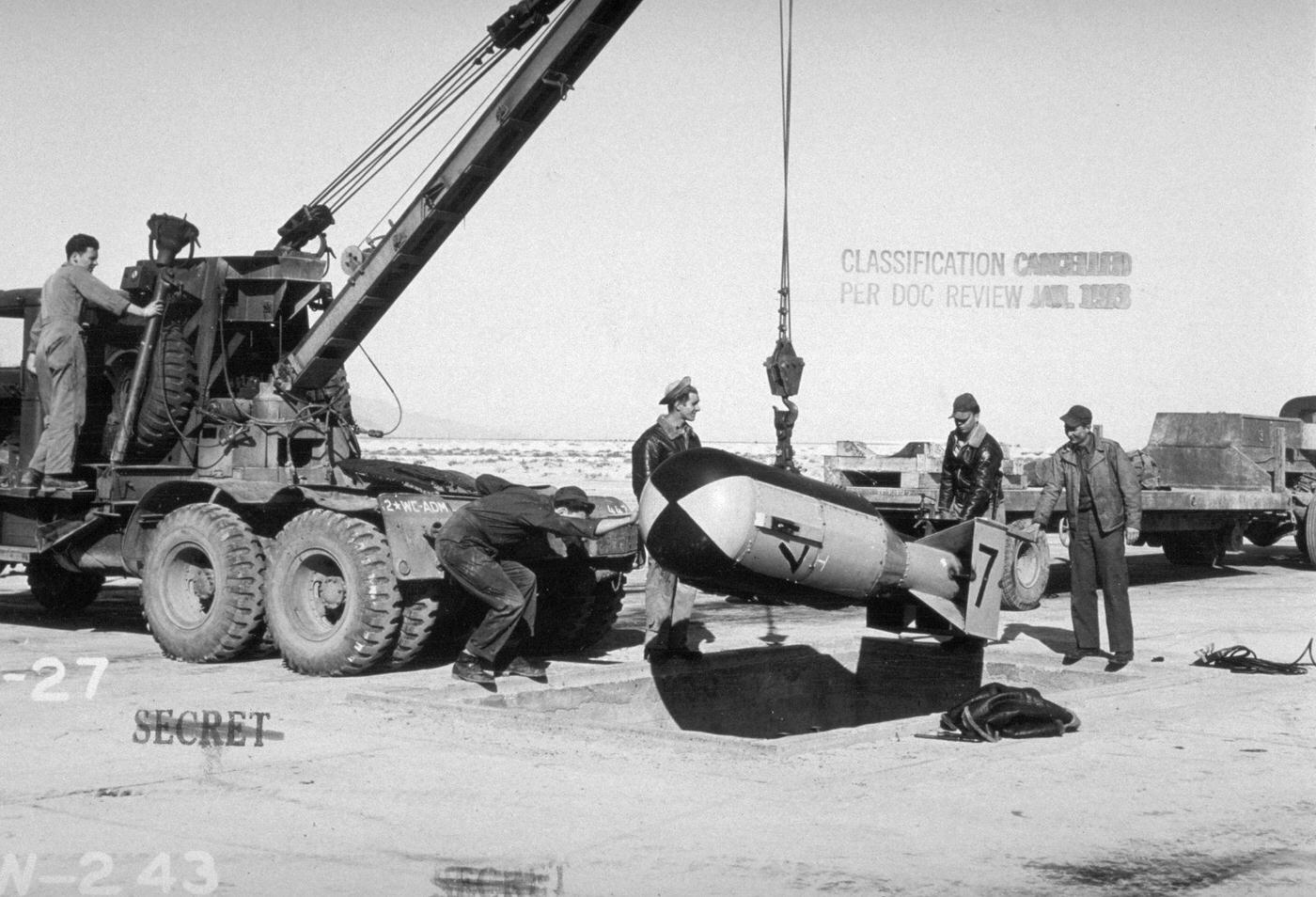 Military Personnel Loading Bomb onto Crane, New Mexico
